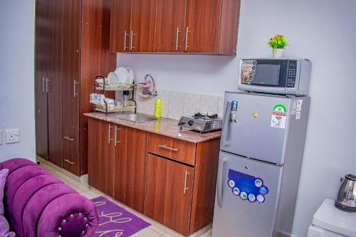 Kuchyň nebo kuchyňský kout v ubytování Belaire BnB Ruaka 3