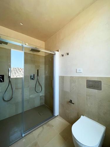 a bathroom with a shower and a toilet at La casa di Irene - Suites con vista in Ragusa