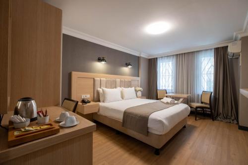 Llit o llits en una habitació de Berr Hotel
