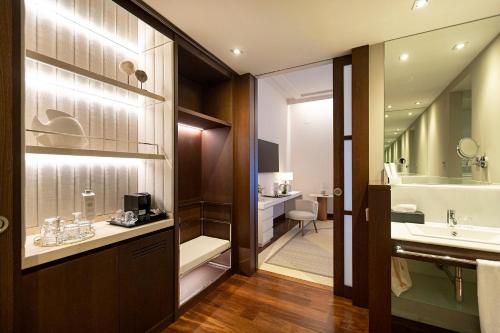 a bathroom with a sink and a toilet at Hospes Amérigo, Alicante, a Member of Design Hotels in Alicante