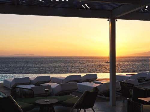 a view of the ocean from the deck of a cruise ship at Kouros Hotel & Suites in Mýkonos City