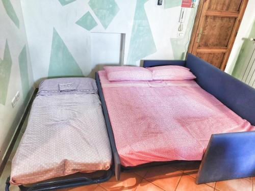 Łóżko lub łóżka w pokoju w obiekcie Maremma Toscana House