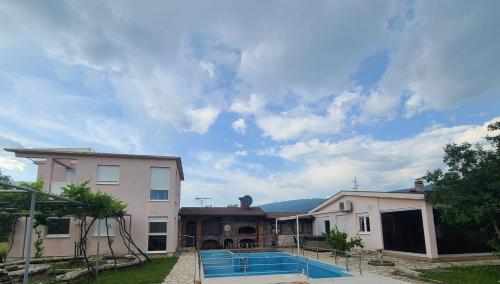 a house with a swimming pool in the yard at Hacienda Kolenda in Mostar