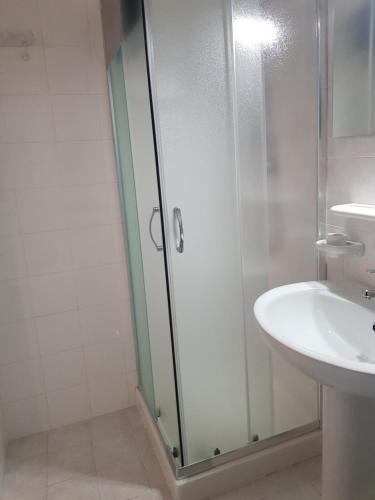 a bathroom with a shower and a sink at DOMVS GIVLIANO in Valguarnera Caropepe