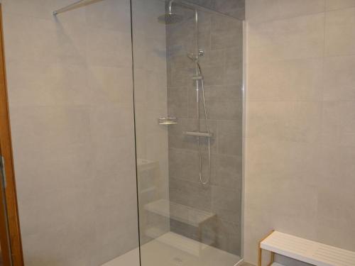 a shower with a glass door in a bathroom at Apartment Apart Hof Achenrainer by Interhome in Landeck