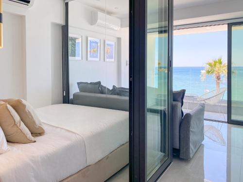 a bedroom with a bed and a view of the ocean at Phaedrus Living: Marina Sea View Flat 214 Emerald in Paphos
