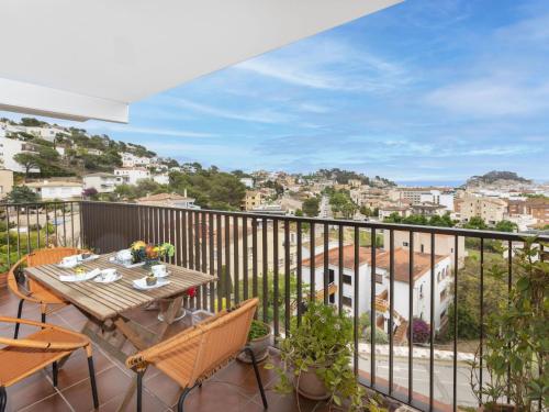 a patio with a table and chairs on a balcony at Apartment Sa Coma by Interhome in Tossa de Mar