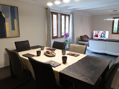 a dining room with a table and chairs at Apartment L'Avenir-2 by Interhome in Presinge