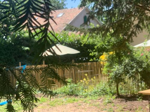 a garden with a fence and a house at Apartment L'Avenir-2 by Interhome in Presinge