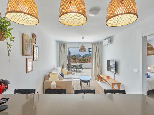 a living room with a couch and a table at Apartment Doña Julia Golf Views by Interhome in Bahia de Casares