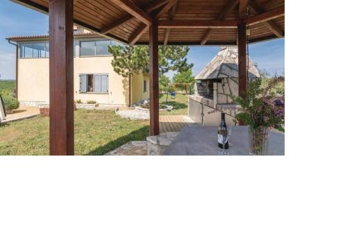 a view of a house from the back yard at Villa Una Apartments in Labin