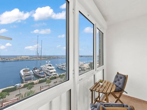 a balcony with a view of the water and boats at Apartment Puerto Denia Cervantes-2 by Interhome in Denia