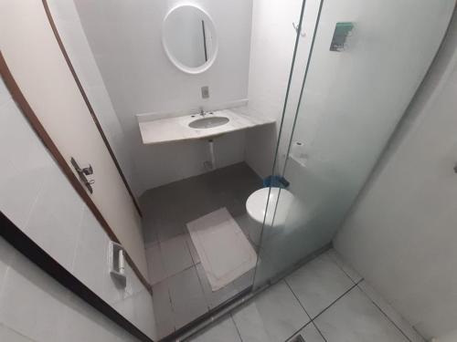 a small bathroom with a sink and a mirror at HOTEL CAMPO ALEGRE in Campo Alegre
