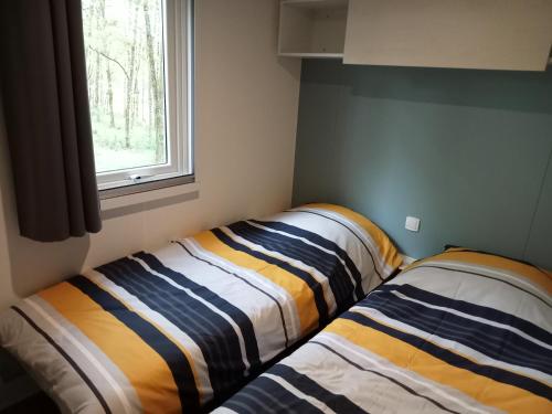 Postel nebo postele na pokoji v ubytování Mobile Home