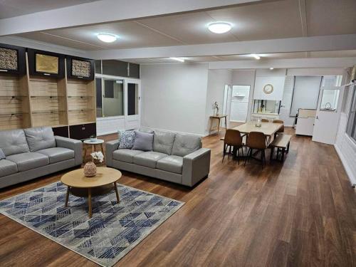a living room with a couch and a table at Riverview Haven in Waikerie