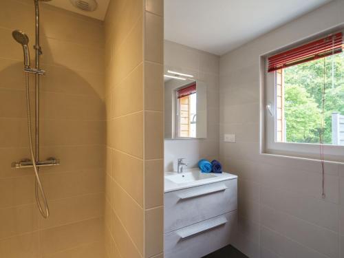 a bathroom with a sink and a shower at Holiday Home Pointe du Raz by Interhome in Plovan
