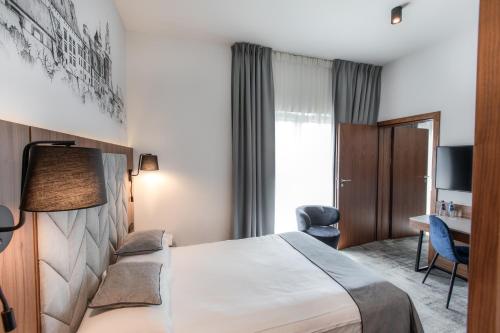 Postel nebo postele na pokoji v ubytování Focus Hotel Premium Kraków