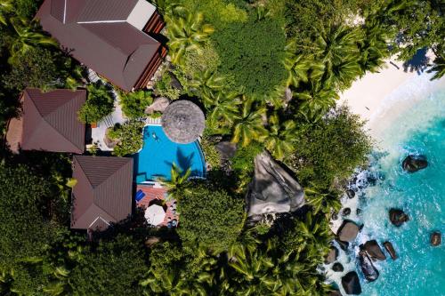 an aerial view of a resort and the ocean at Hilton Seychelles Labriz Resort & Spa in Silhouette Island