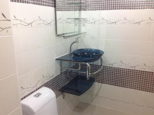 a bathroom with a sink and a toilet at Junior Apartment in Pattaya