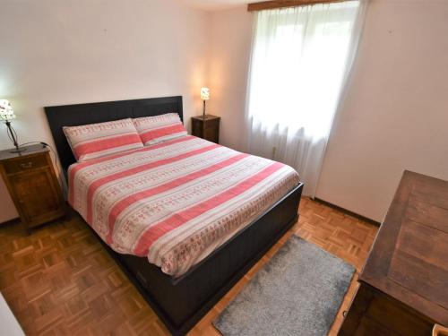 A bed or beds in a room at Apartment Isola di Madesimo Apartments-1 by Interhome