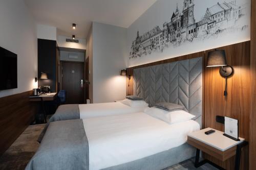 Postel nebo postele na pokoji v ubytování Focus Hotel Premium Kraków