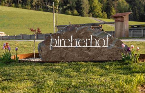 a rock with the word girlfriend written on it in the grass at Pircherhof - Adults Only am Biobauernhof in Pöllau