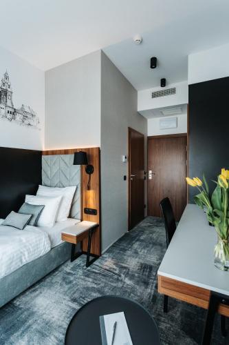 Postel nebo postele na pokoji v ubytování Focus Hotel Premium Kraków
