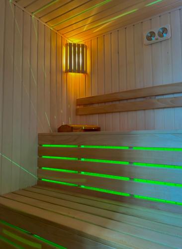a sauna with green lights on the stairs at Luxmani Hotel & Spa in Tbilisi City