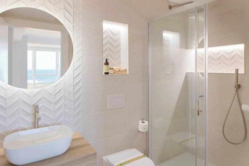 a bathroom with a shower and a toilet and a sink at Argus San Lorenzo By Silastur in Gijón