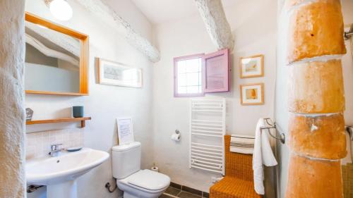 a white bathroom with a sink and a toilet at The Casita Spain Huercal-Overa by Ruralidays in Los Camachos