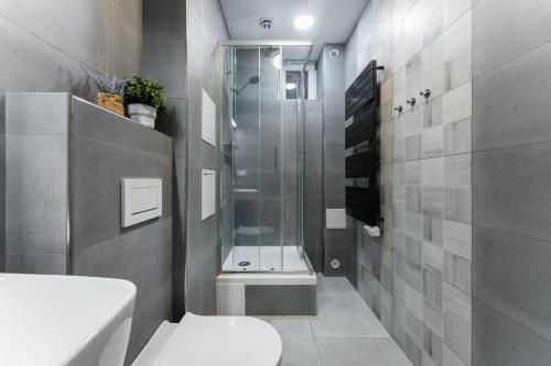 a bathroom with a shower and a toilet at Wenceslas square apartment in Prague