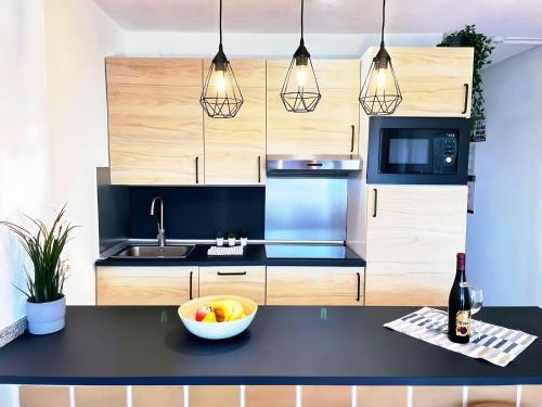 a kitchen with a bowl of fruit on a counter at Seaview Friendly Holiday Home 8 in Playa del Ingles