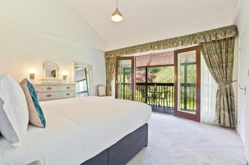 Un ou plusieurs lits dans un hébergement de l'établissement Sawmill Cottage, Coniston Water