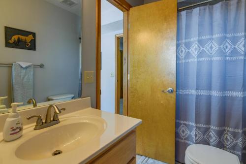 a bathroom with a sink and a toilet and a shower at Mtn-View Escape with Hot Tub, 9 Mi to Skiing! in Maggie Valley