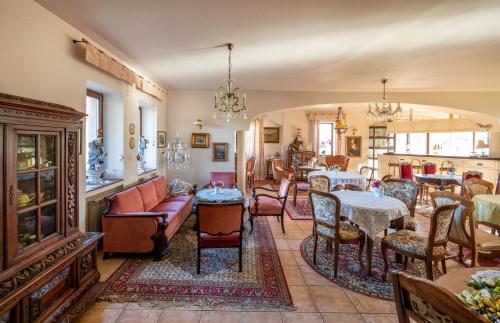 a living room filled with furniture and a table at Ranczo Mustafa in Bobolin