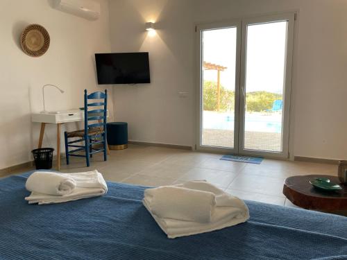 a room with a bed with towels on the floor at Villa Valleyview Methoni in Methoni