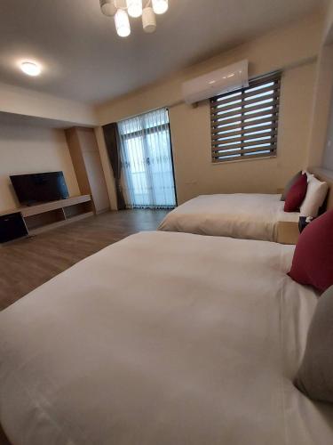 Postel nebo postele na pokoji v ubytování Miss Travel Homestay