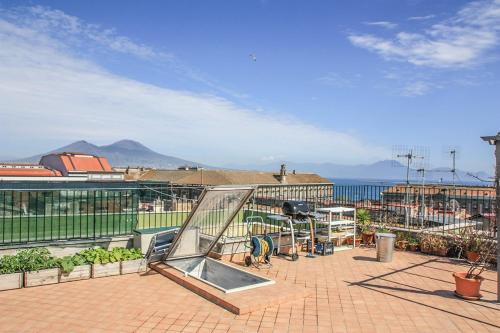 a patio with a view of the ocean at B&B Trieste&Trento in Naples
