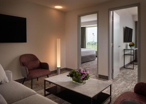 a living room with a couch and a table at Great Canadian Casino Resort Toronto in Toronto