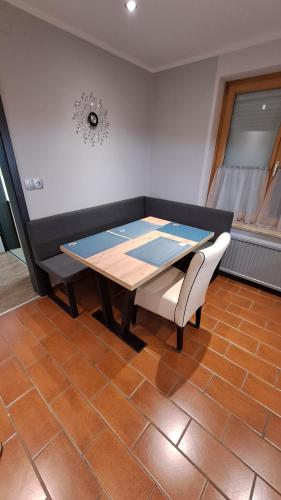 a table and a chair in a room at Come a casa 