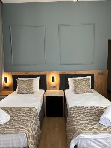 two beds sitting next to each other in a room at Newalla Hotel Old City in Istanbul
