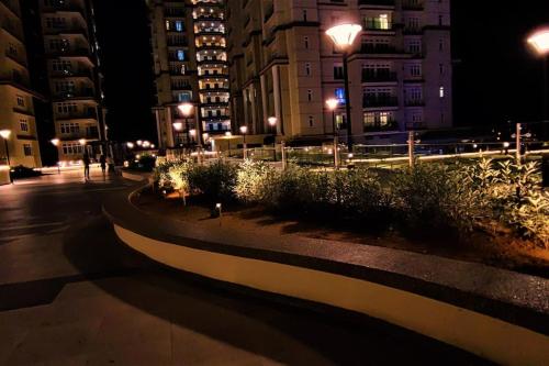 a city street at night with buildings and lights at Boutique Studio- Riverine Diamond in Kuching