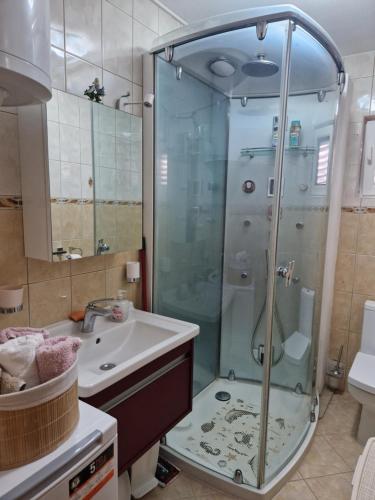 a bathroom with a shower and a sink at Apartment CHARLY in Supetar