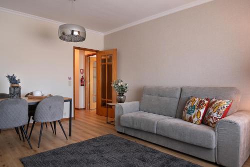 a living room with a couch and a table at Gaia Douro Apartment in Vila Nova de Gaia