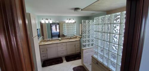 a bathroom with a sink and a mirror at Getaway Canal in Palm Coast