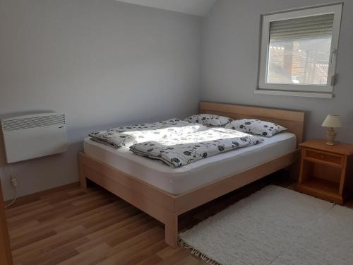 Кровать или кровати в номере Tihanyi Vendégház