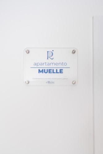 a sign that reads apparatusidium mule at Apartamentos El Reloj in Luanco
