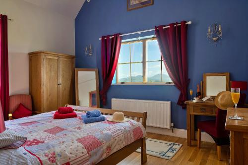 a bedroom with a bed with red curtains and a window at Finest Retreats - Skyview Lodge in Eglwys-Fâch