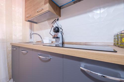 a kitchen with a sink and a counter at Damilhouse 1 in Messina