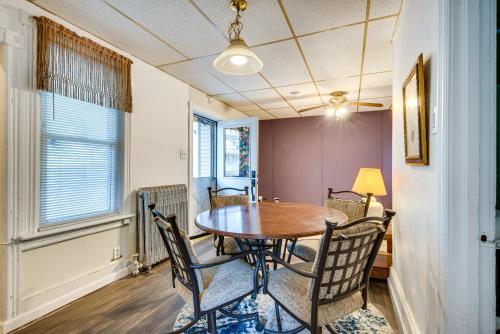a dining room with a wooden table and chairs at Pool Access Bath Vacation Rental Condo! in Hollo